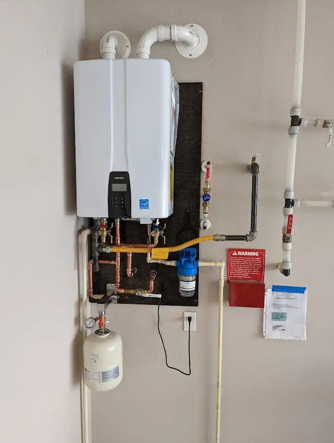 Professional plumber installing copper piping in a Calumet City home